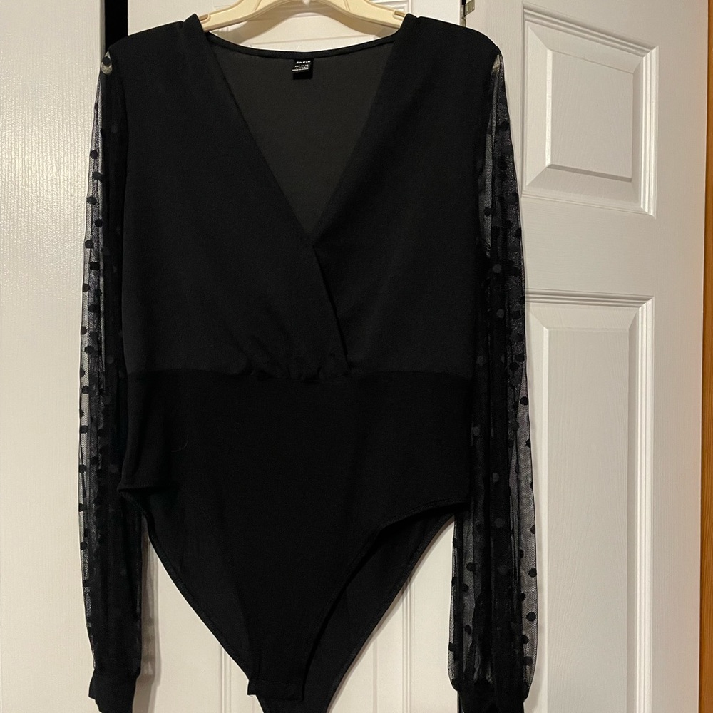 Shein women’s bodysuit black with sheer polkadot sleeves. Never worn, size L